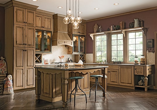 Gothic farmhouse-inspired kitchen in Husk finish with distressed technique