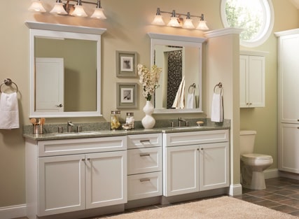 Traditional bathroom with two KraftMaid vanity sink bases in Thermofoil White