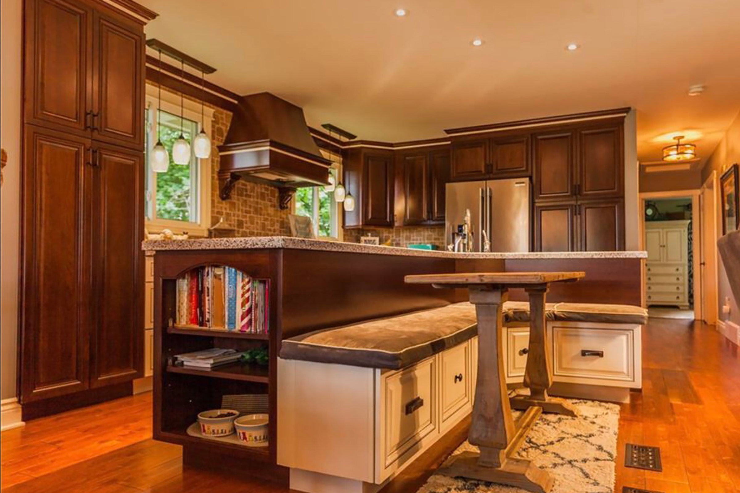 KraftMaid traditional kitchen designs with island seating in two-tone paint and stain color scheme