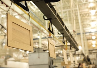 Overhead conveyor system moving cabinet doors through the manufacturing process at the KraftMaid Middlefield, Ohio, plant